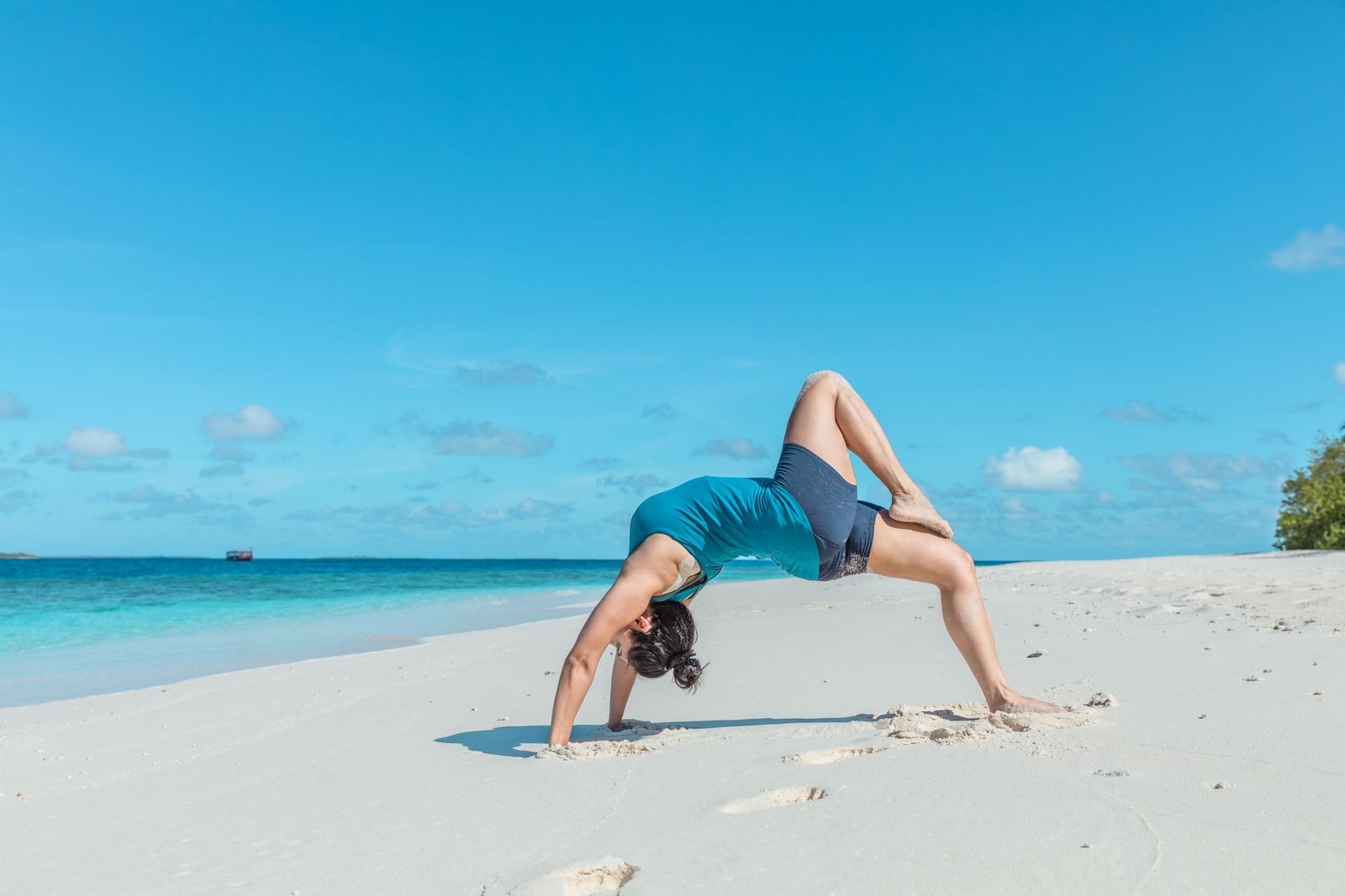yoga on beach health and wellness