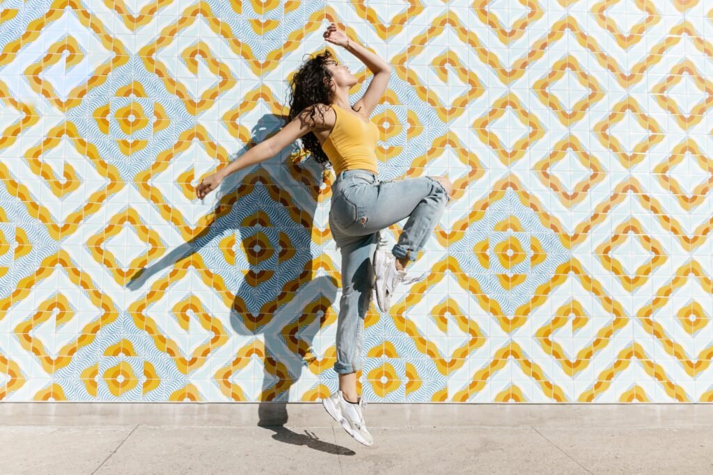 happy woman dancing, raise your vibration
