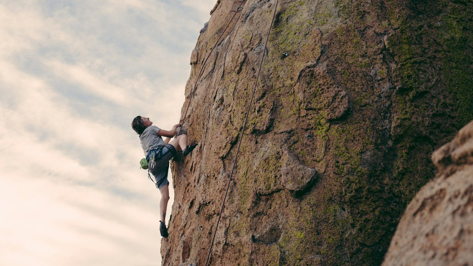 person climbing a mountain